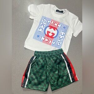 White Tee with Red & Blue Logo and Green Monogram Shorts